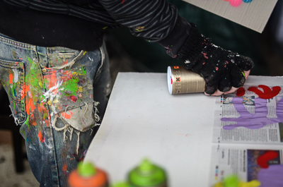 Bortusk painting a monster in his studio