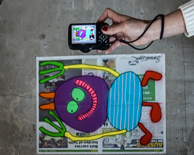 Jessica, who works with Bortusk, shooting a happy monster