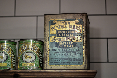 My Dog Sighs at home - old food cans in the kitchen