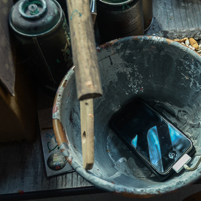 Inside Astro's studio - Phone in a bucket