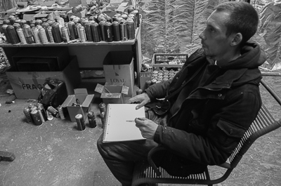 Astro sketching in front of his canvas