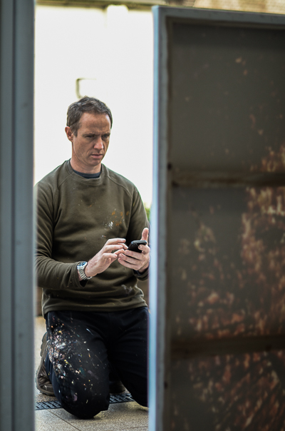 Jimmy C shooting his finished canvas