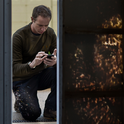 Jimmy C shooting his finished canvas