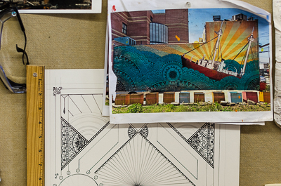 Sketches and picture of one of Beau Stanton's walls in Brooklyn pinned on board