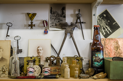 Inside Beau Stanton's studio- curiosity shelf filled with tools, keys, medals and artefacts found on the shore of Dead Horse Bay in Brooklyn