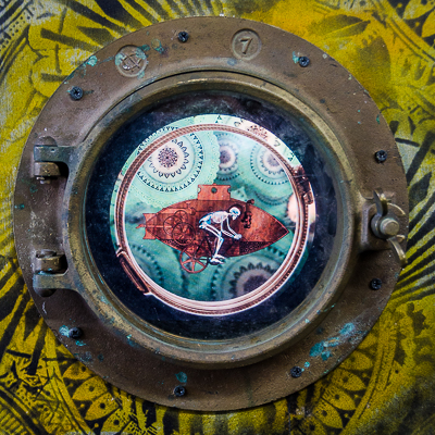 Submariner animated painting inside a salvaged porthole