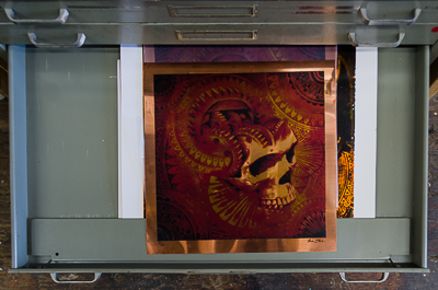 Skull on a metal foil