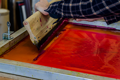 Work in progress - Beau Stanton pulling over the ink on the screen with a squeegee