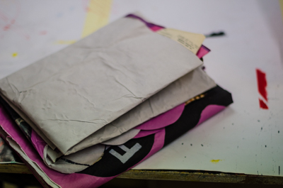 Folded works ready to be pasted in Paris