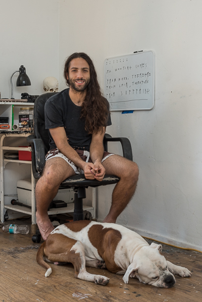 Axel Void in his studio in Miami with Rocco