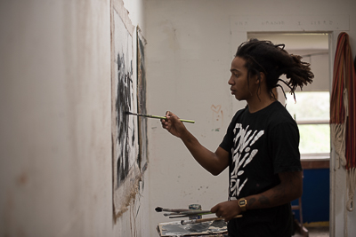 Reginald O'Neal working on a piece at Axel Void's studio